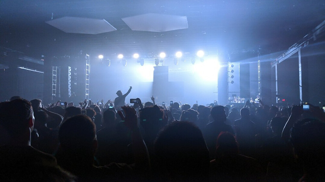 Concert crowd with stage lights at a live music show